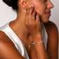 LUMINOUS PAVÉ CROSS HUGGIE HOOP EARRINGS