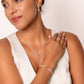 LUMINOUS CROSS PAVÉ RING