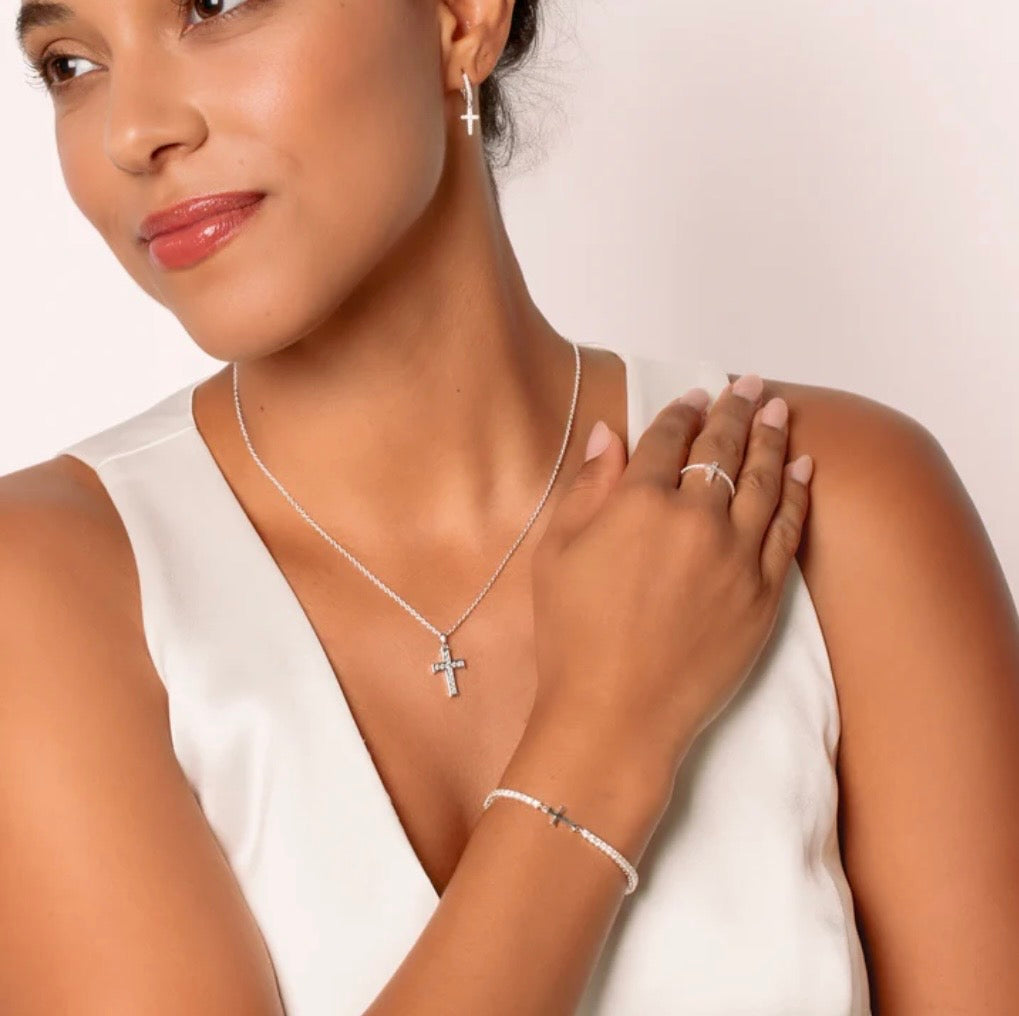 LUMINOUS CROSS PAVÉ RING